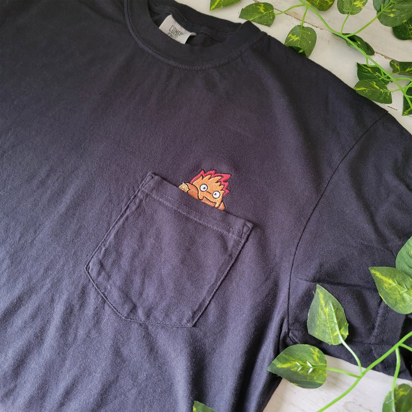 Calcifer Yule Log Pocket Tee